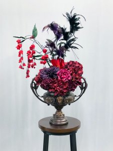 Roman style urn vase with flowers
